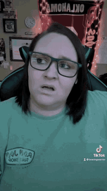a woman wearing glasses and a t-shirt that says ' hot dog gone ' on it