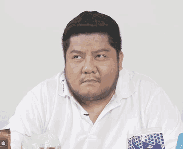 a man wearing a white shirt with the word champion on the sleeve