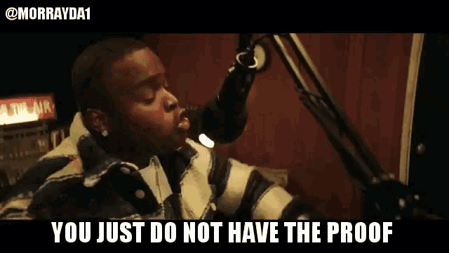 a man singing into a microphone with the words " you just do not have the proof " below him
