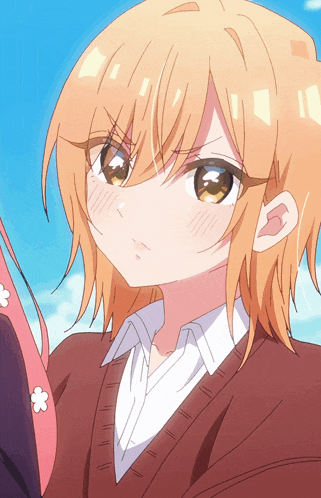 a close up of a girl 's face with a blue sky in the background