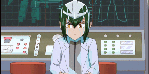 a cartoon character with green hair and a white helmet sitting in front of a monitor