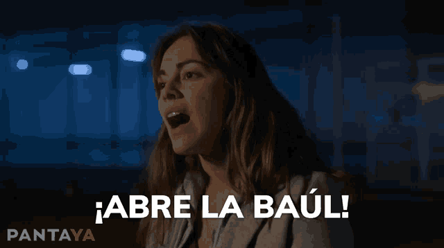 a woman says " abre la baul " in spanish in a dark room