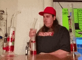 a man wearing a red hat and a shirt that says ' lone state ' on it