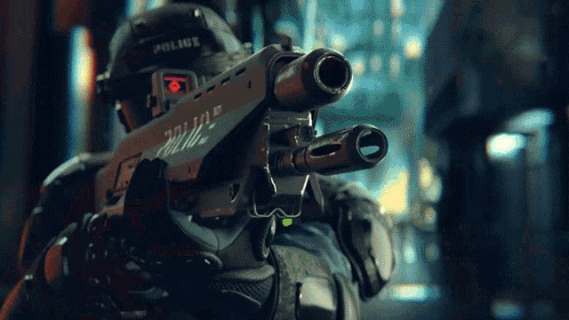 a police officer is holding a gun with the word police written on it
