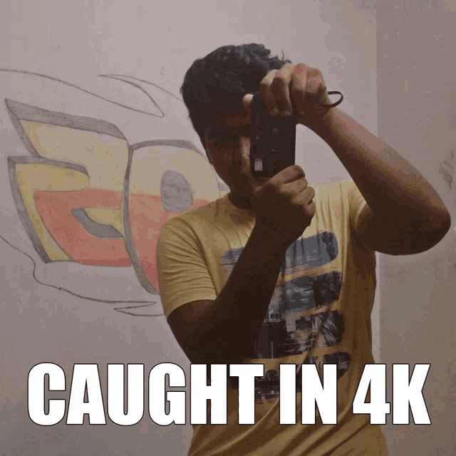 a man taking a picture of himself with the words caught in 4k above him