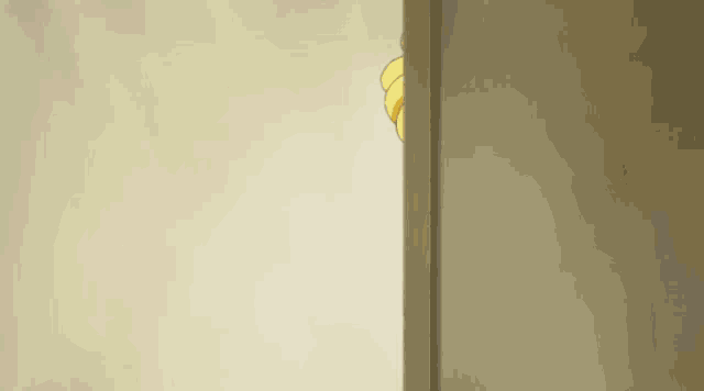 a girl with blonde hair is peeking out from behind a door