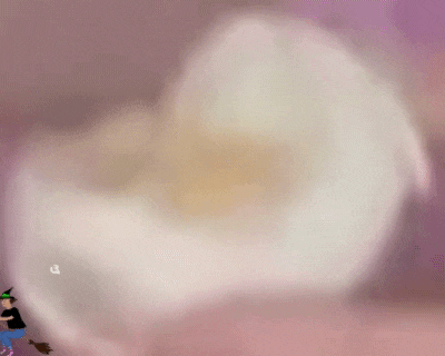 a blurry picture of a person riding a broom with a white object in the background