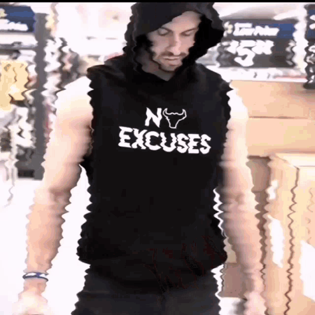 a man is wearing a black shirt that says no excuses