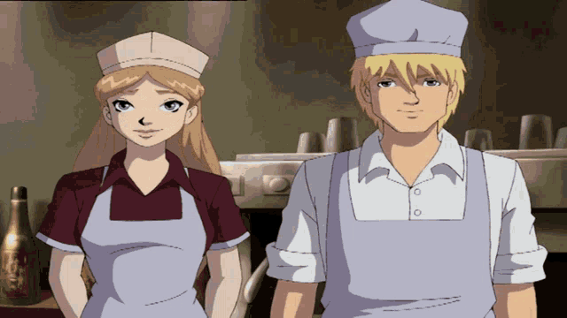 a man and a woman standing next to each other wearing aprons