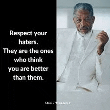 a man in a white suit and tie is sitting on a couch with a quote .