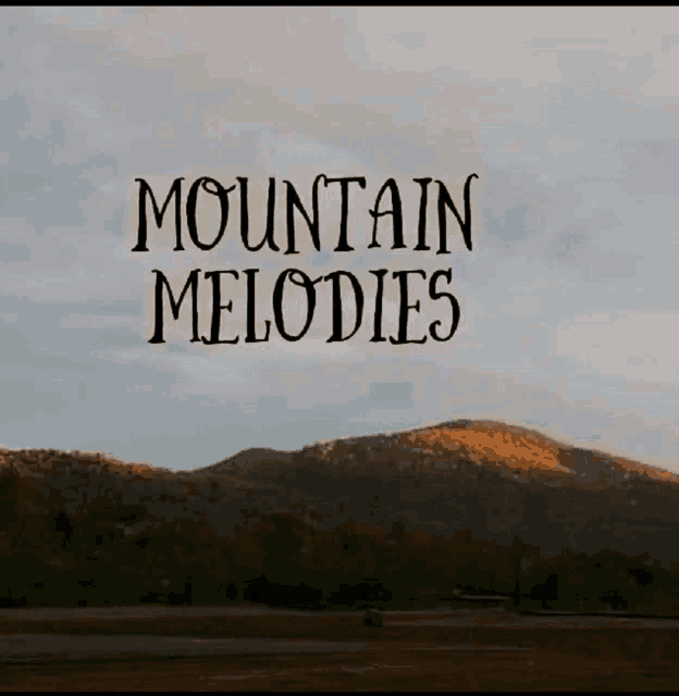 a mountain with the words mountain melodies written in front of it