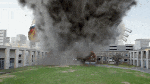 a tornado is coming out of a building in the city