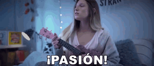 a woman is playing an ukulele and the word pasion is written above her