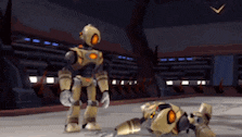 a robot is standing next to another robot that is laying on the floor .