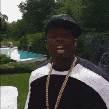 a man in a suit and tie is holding a white bucket over his head