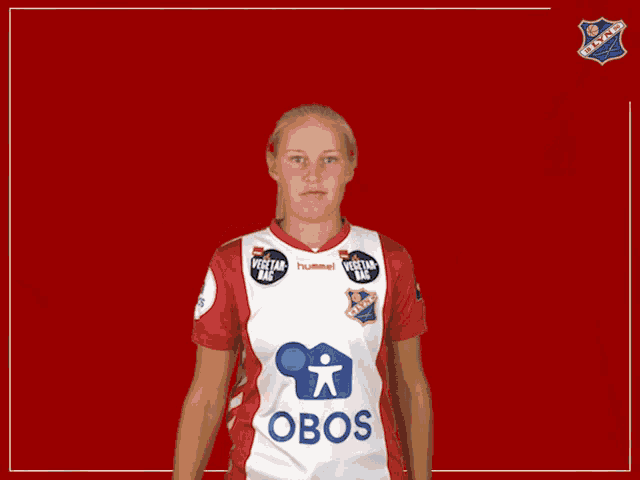 a woman wearing a red and white jersey that says obos on it