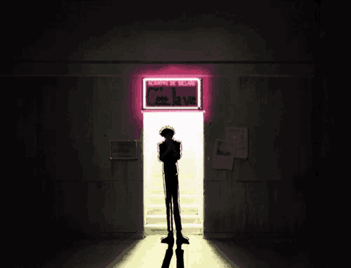 a man is standing in front of a door with a neon sign that says c'est la vie