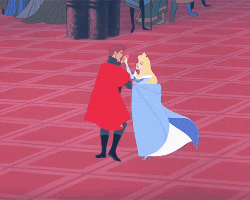 a woman in a pink dress is dancing with a man in a red cape