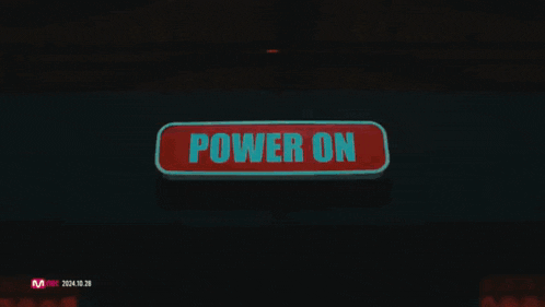 a red sign that says power on on a wall