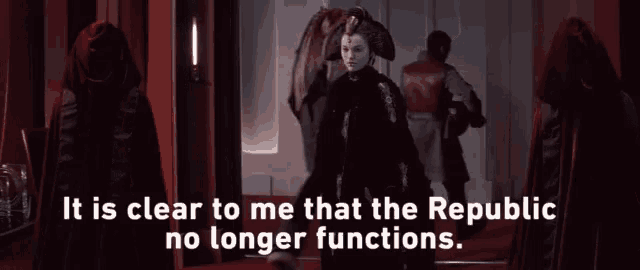 a woman stands in front of a sign that says it is clear to me that the republic has no longer functions