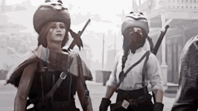 two women are standing next to each other in a foggy area . one of the women is wearing a bear hat .
