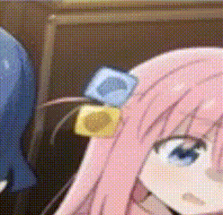 a close up of a pink haired anime girl with a condom on her ear .