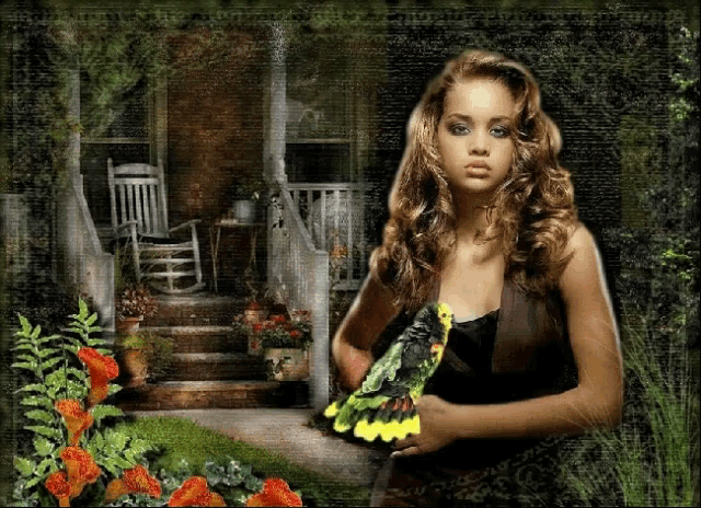 a woman holding a parrot in front of a house