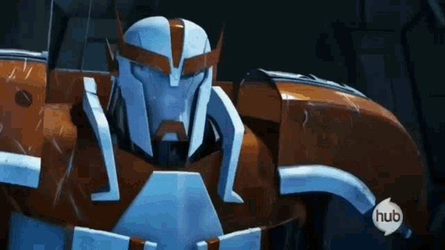 a close up of a transformer robot with a hub logo on the bottom right corner .