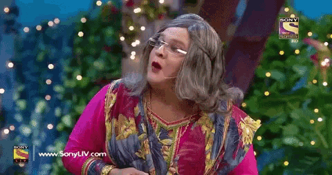 a man in a wig and glasses is on a sony tv show