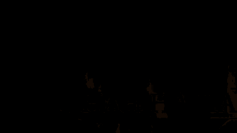 a group of cartoon characters are standing next to each other in a room .