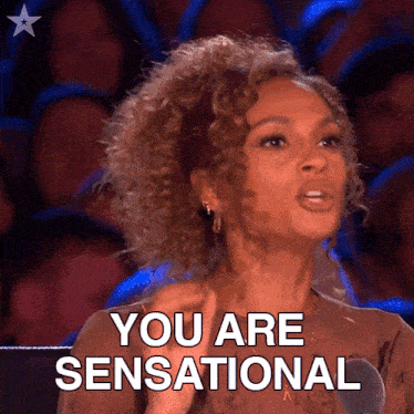 a woman in front of a crowd says you are sensational