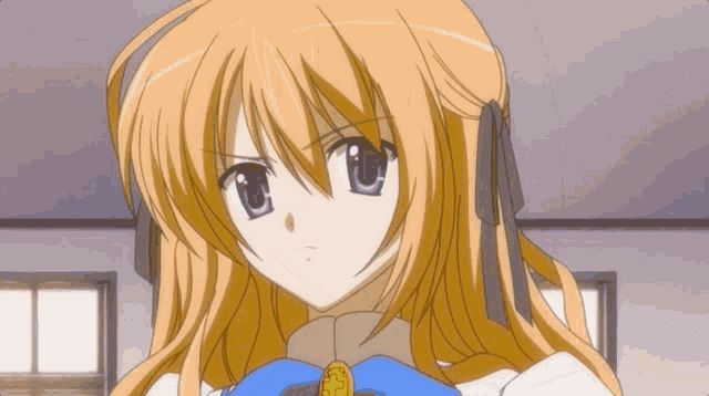 a close up of a girl 's face with a blue bow