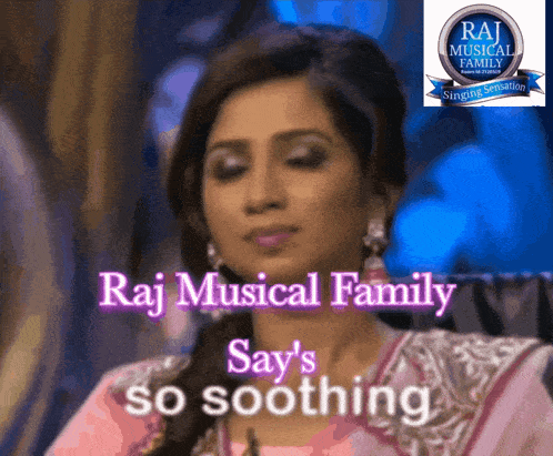 a woman sitting in front of a sign that says raj musical family