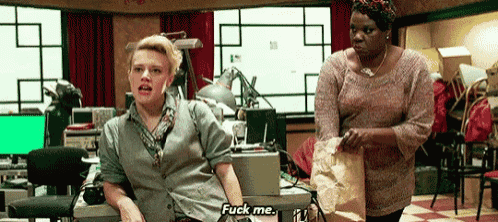 two women are standing next to each other in an office and one of them is saying " fuck me "