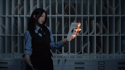 a woman is holding a burning book that says london festival on it