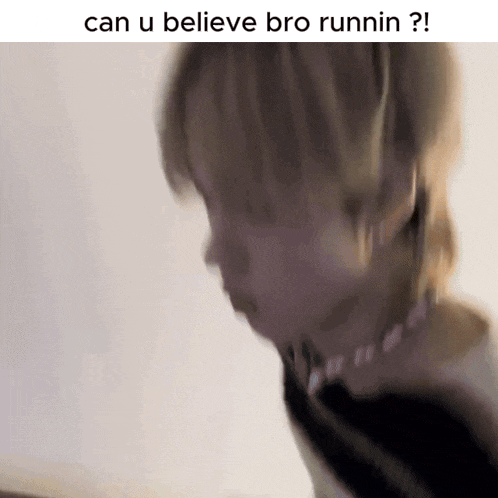 a blurry picture of a person with the words can u believe bro runnin