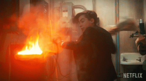 Putting Out A Fire Five GIF - Putting Out A Fire Five Aidan Gallagher GIFs
