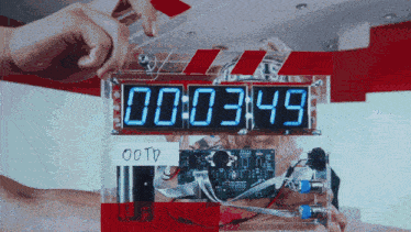 a digital clock displays the time of 00 : 03 : 49