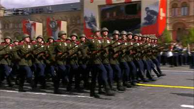 a row of soldiers marching in front of a sign that says ' russia '