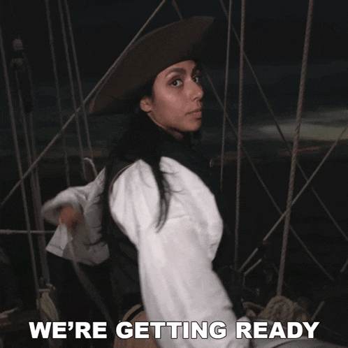 a woman in a pirate costume with the words we 're getting ready below her