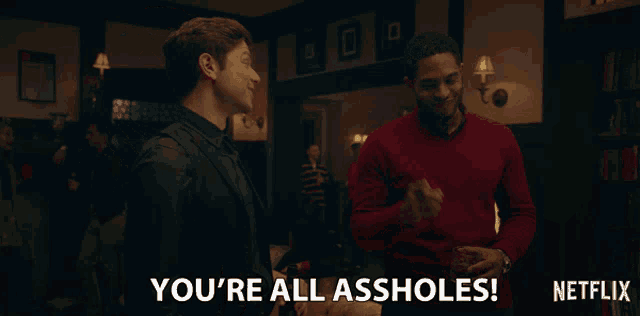 a man in a suit says " you 're all assholes " in a netflix ad