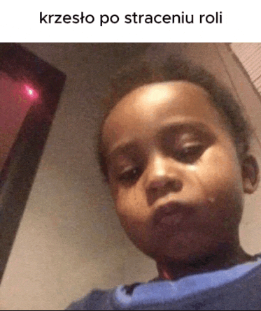a young boy with a tear running down his cheek