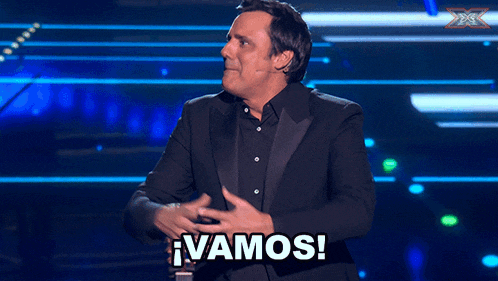a man with his fist in the air and the word vamos written below him