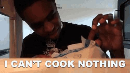 a man holding a piece of paper with the words i can 't cook nothing below him