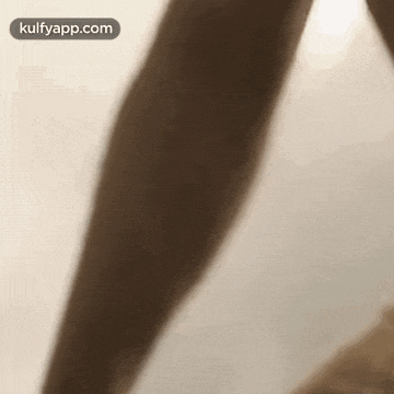 a close up of a person 's arm and leg .