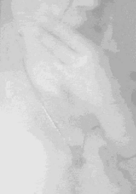a black and white photo of a person 's face