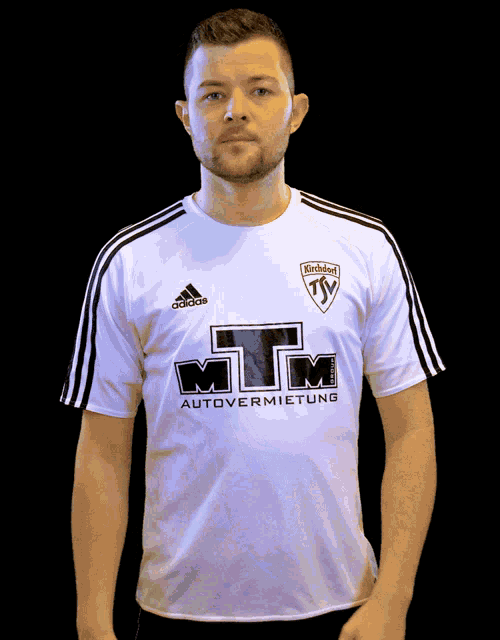 a man is wearing a white adidas shirt with mtm autovermietung on it