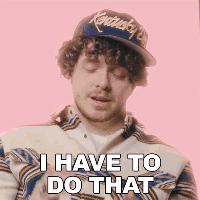 a man with curly hair wearing a kentucky hat says i have to do that