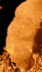 a close up of a fire explosion with smoke coming out of it