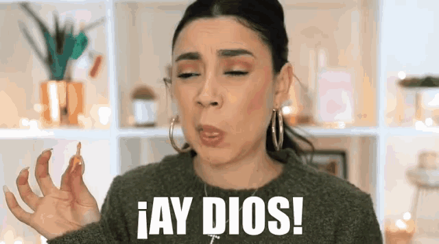 a woman making a funny face with the words jay dios on the bottom
